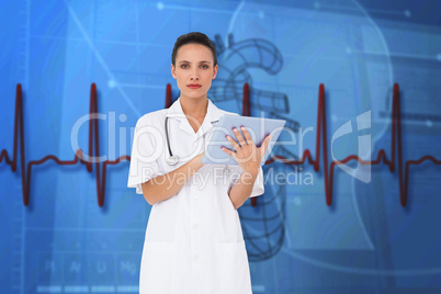 Composite image of pretty nurse using tablet pc