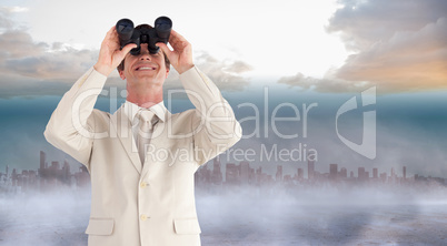 Composite image of confident businessman with binoculars