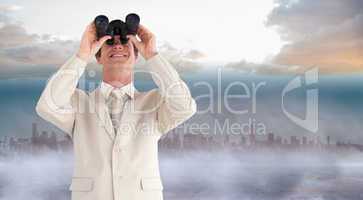 Composite image of confident businessman with binoculars