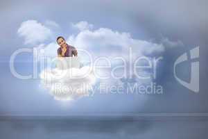 Composite image of thinking man sitting on cloud using laptop an