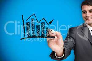 Composite image of businessman drawing graph