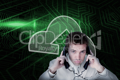 Composite image of cloud computing and businessman tangled in wi