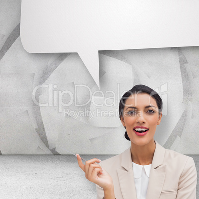 Composite image of smiling businesswoman holding a pen