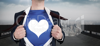 Composite image of businessman opening his shirt superhero style