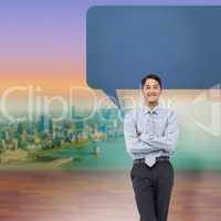 Composite image of smiling asian businessman with speech bubble