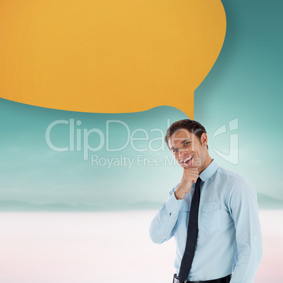 Composite image of thoughtful businessman with speech bubble wit