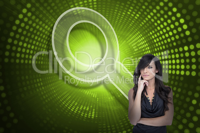 Composite image of magnifying glass and sexy brunette