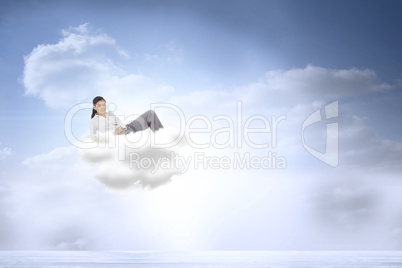 Composite image of relaxed businesswoman lying