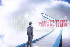 Conviction against red staircase arrow pointing up against sky