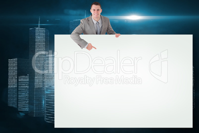 Composite image of businessman showing card