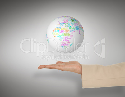 Composite image of female hand presenting globe