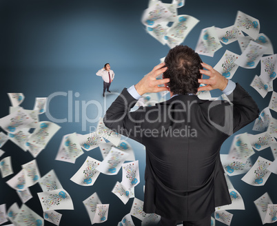 Composite image of stressed businessman with hands on head with