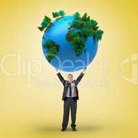 Composite image of businessman holding earth