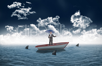 Composite image of peaceful businessman holding blue umbrella in