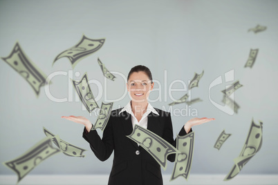 Composite image of charming woman in suit showing dollars
