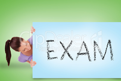 Pretty brunette showing card with exam