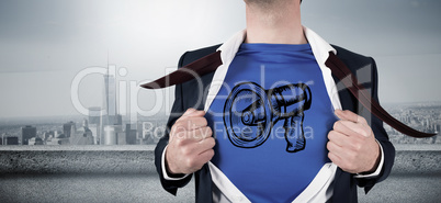 Composite image of businessman opening his shirt superhero style