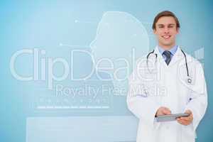 Composite image of young doctor using tablet pc