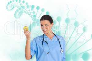 Composite image of happy surgeon holding an apple and smiling at