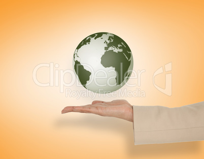 Composite image of female hand presenting earth Composite image of female hand presenting earth