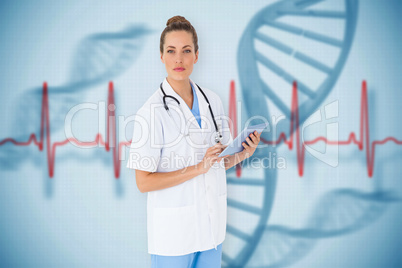 Composite image of pretty nurse using tablet pc