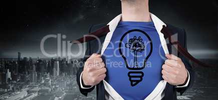 Composite image of businessman opening his shirt superhero style