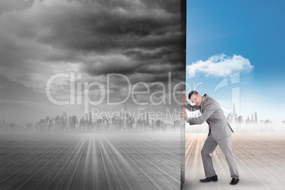 Composite image of businessman pushing away scene