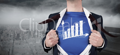 Composite image of businessman opening his shirt superhero style