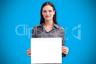 Composite image of businesswoman showing card