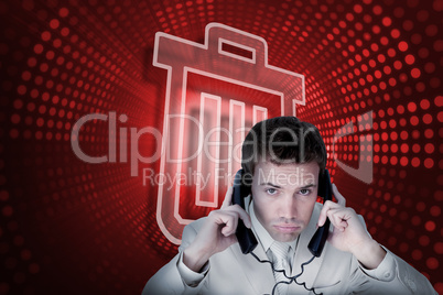 Composite image of trash can and businessman tangled in wires