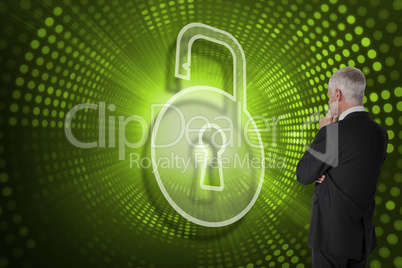 Composite image of lock and businessman looking