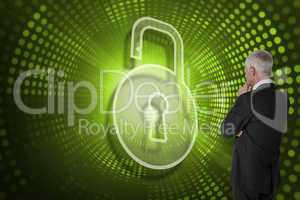 Composite image of lock and businessman looking