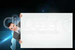 Composite image of businessman showing card