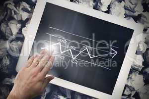 Composite image of hand touching tablet