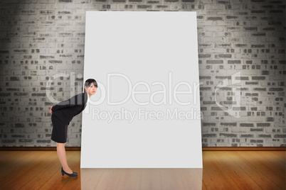 Composite image of serious businesswoman bending