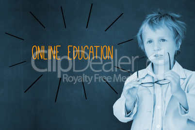 Online education against schoolboy and blackboard