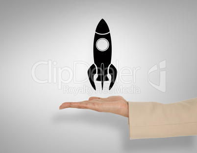 Composite image of female hand presenting rocket