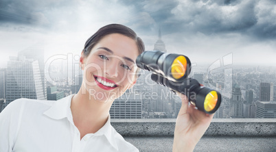 Composite image of smiling businesswoman with binoculars