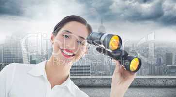 Composite image of smiling businesswoman with binoculars