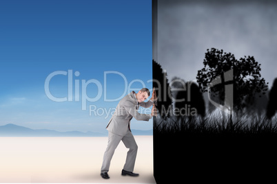 Composite image of businessman pushing away scene