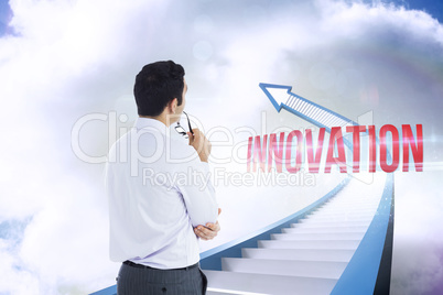 Innovation against red staircase arrow pointing up against sky