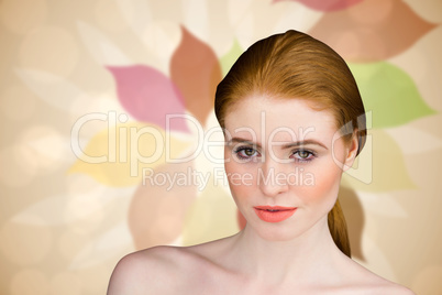 Composite image of beautiful redhead looking at camera