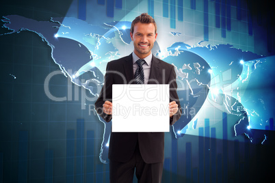 Composite image of businessman showing card