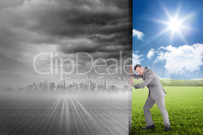 Composite image of businessman pushing away scene