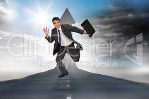 Composite image of cheerful businessman in a hurry