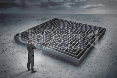 Composite image of thinking businessman