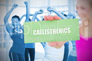 Fit blonde holding card saying callisthenics