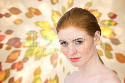 Composite image of beautiful redhead looking at camera