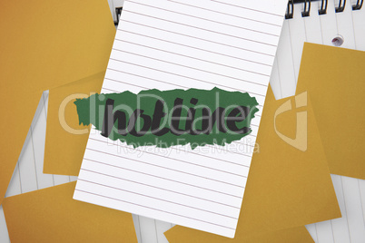 Hotline against yellow paper strewn over notepad