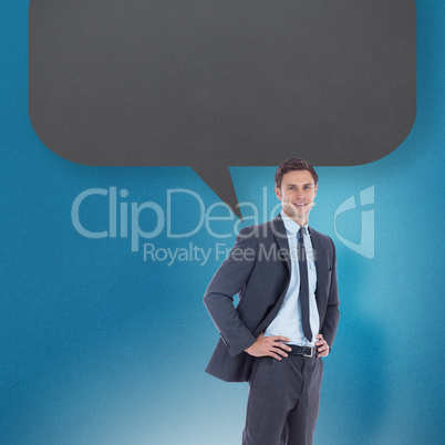 Composite image of smiling businessman with hands on hips with s